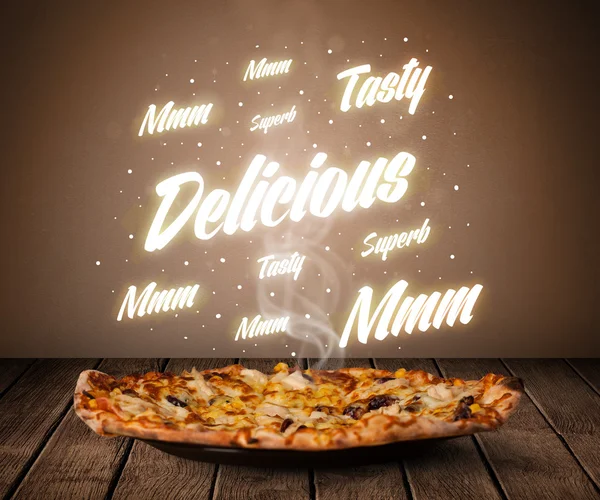 Pizza with delicious and tasty glowing writings — Stock Photo, Image