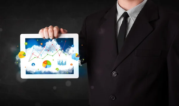 Person holding a touchpad with cloud technology and charts — Stock Photo, Image