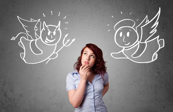 Woman standing between the angel and the devil — Stock Photo, Image