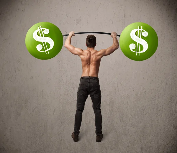 Muscular man lifting green dollar sign weights — Stock Photo, Image