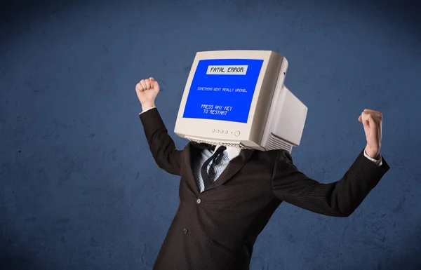 Person with a monitor head and fatal error blue screen on the di — Stock Photo, Image