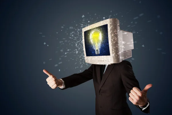 Business man with a pc monitor head and idea light bulb in the d — Stock Photo, Image