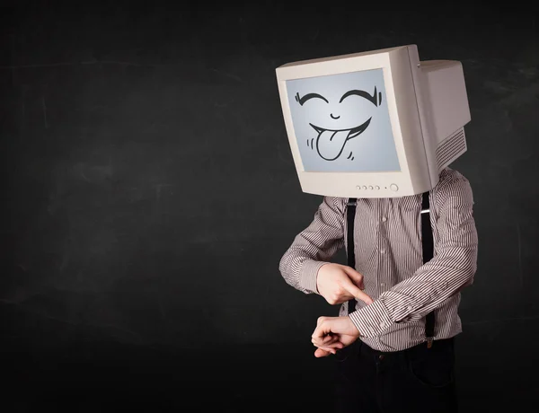 Homem de negócios feliz com um monitor de computador e um rosto sorridente — Fotografia de Stock