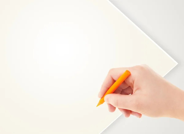 Child drawing with colorful crayon on empty blank paper — Stock Photo, Image