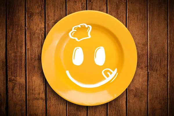 Cara de dibujos animados sonriente feliz en plato colorido —  Fotos de Stock