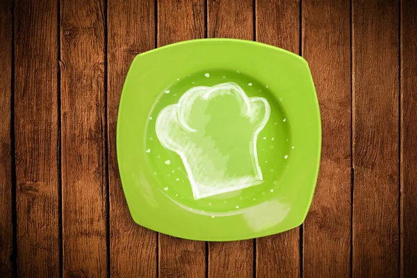 El çizimi beyaz şef sembollü renkli bir tabak.