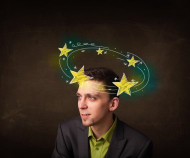 Young man with yellow stars circleing around his head clipart
