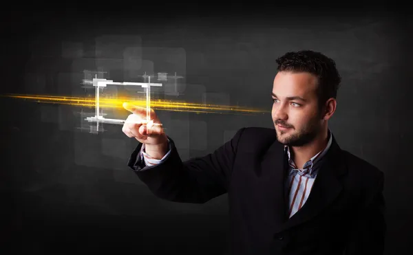 Tech business person touching button with orange light beams con — Stock Photo, Image