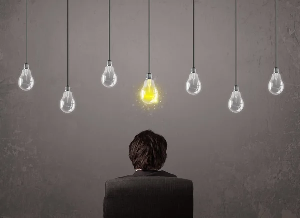 Businness guy in front of idea light bulbs concept — Stock Photo, Image