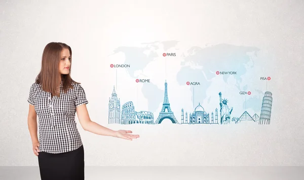 Business woman presenting map with famous cities and landmarks — Stock Photo, Image