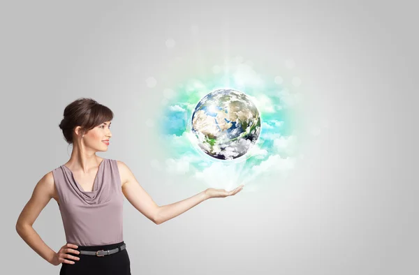 Young woman with earth and cloud concept — Stock Photo, Image