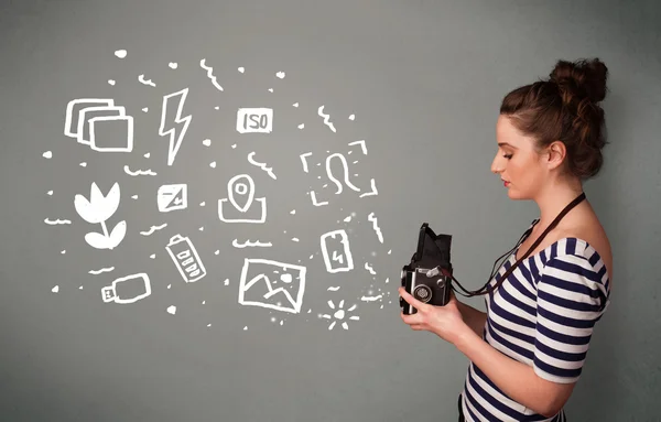 Fotografo ragazza cattura icone e simboli della fotografia bianca — Foto Stock