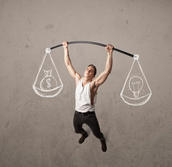 Muscular man trying to get balanced — Stock Photo, Image