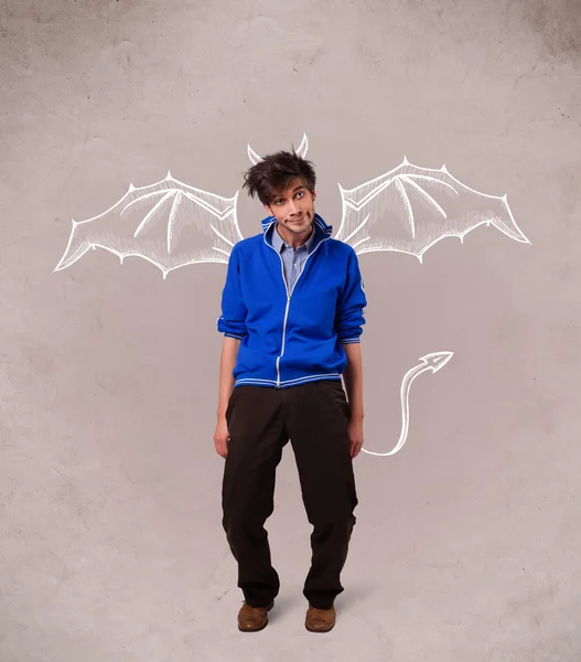 Young man with devil horns and wings drawing — Stock Photo, Image