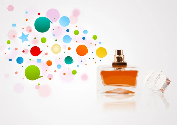 Perfume bottle spraying colored bubbles — Stock Photo, Image