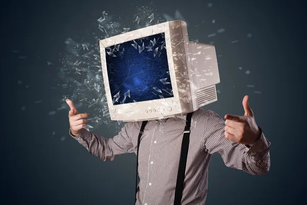 Computer monitor screen exploding on a young persons head — Stock Photo, Image