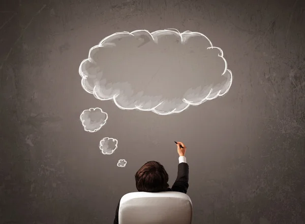 Businessman sitting with cloud thought above his head — Stock Photo, Image