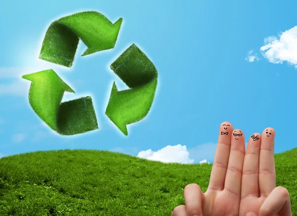 Happy smiley fingers looking at green leaf recycle sign — Stock Photo, Image