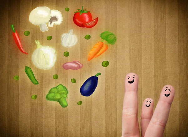 Happy smiley face fingers looking at illustration of colorful he — Stock Photo, Image