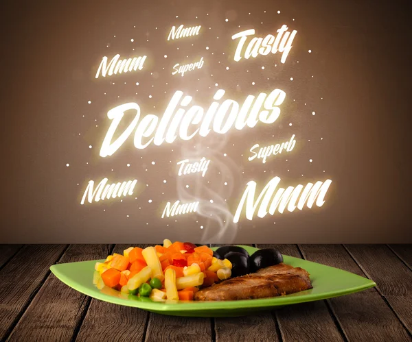 Food plate with delicious and tasty glowing writings — Stock Photo, Image