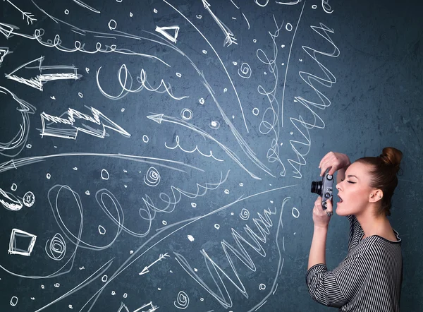 Fotograf som fotograferar bilder medan energiska hand dras linjer en — Stockfoto