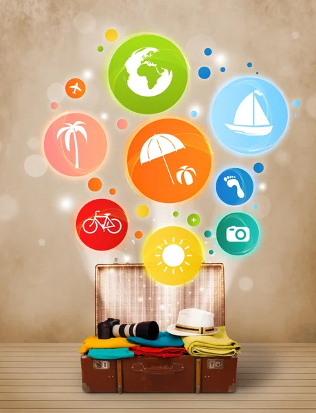 Suitcase with colorful summer icons and symbols — Stock Photo, Image