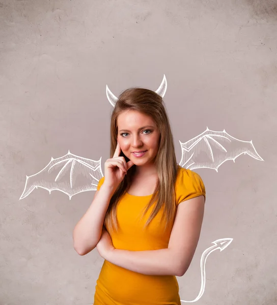 Jong meisje met duivel hoorns en vleugels tekening — Stockfoto