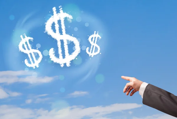 Kéz, mely dollár jel felhőkre mutat a kék égen — Stock Fotó