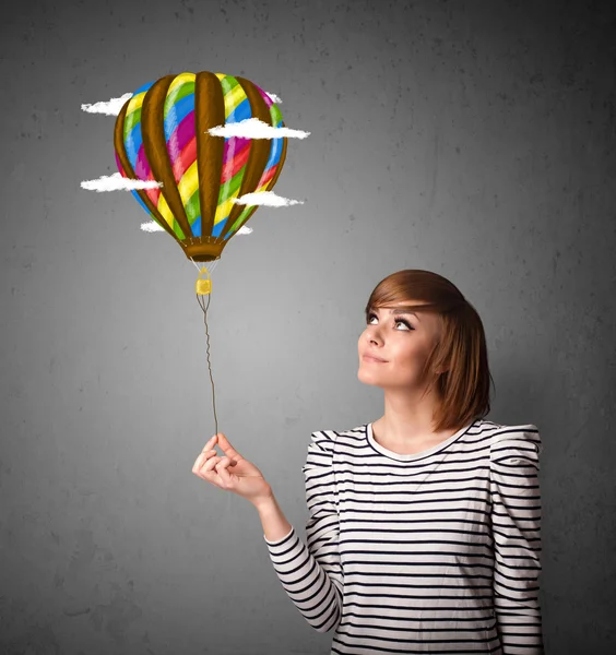 Woman holding a balloon drawing — Stock Photo, Image