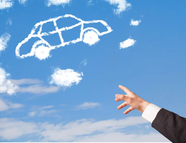 Mão apontando para a nuvem de carro em um céu azul — Fotografia de Stock
