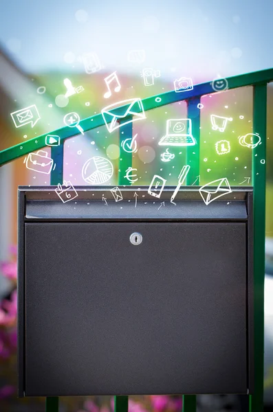Colorful icons and symbols bursting out of a mailbox — Stock Photo, Image