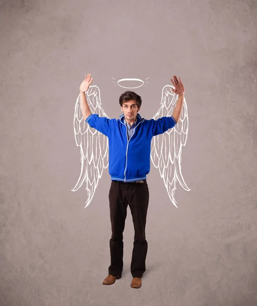 Young man with angel illustrated wings — Stockfoto