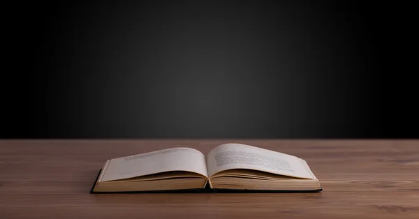 Open book on wooden deck — Stock Photo, Image