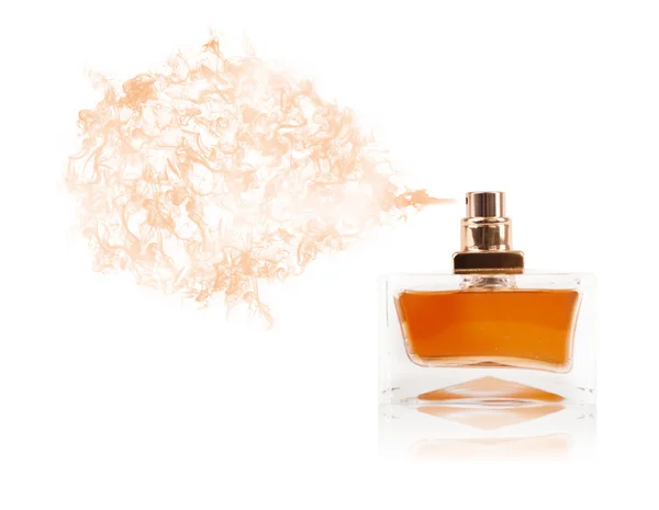 Perfume bottle spraying colored scent — Stock Photo, Image