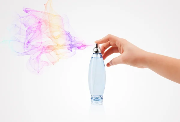 Woman hands spraying perfume — Stock Photo, Image