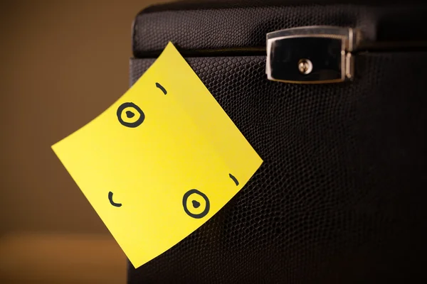 Post-it note with smiley face sticked on jewelry box — Stock Photo, Image