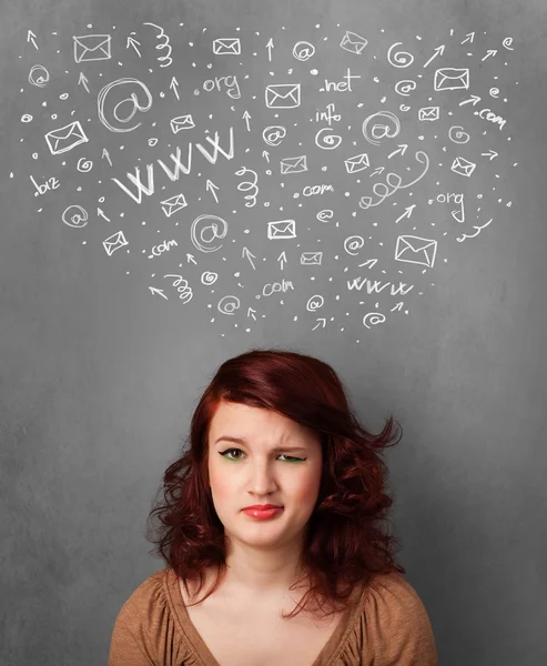 Young woman thinking with social network icons above her head — Stock Photo, Image