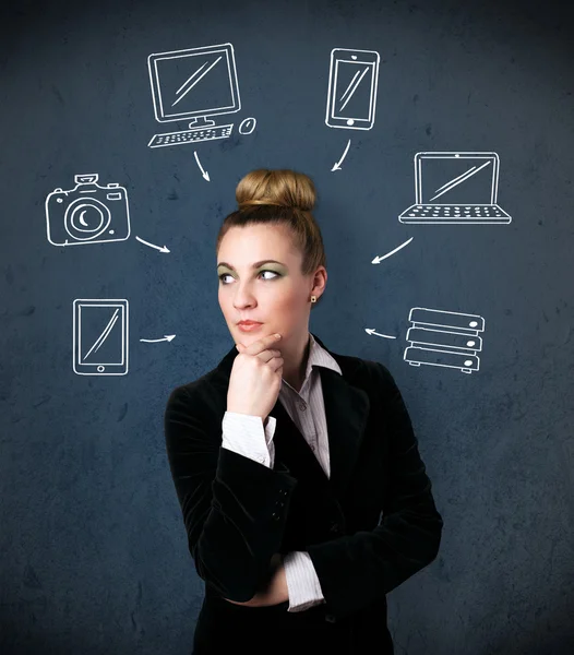 Young woman thinking with drawn gadgets around her head — Stock Photo, Image