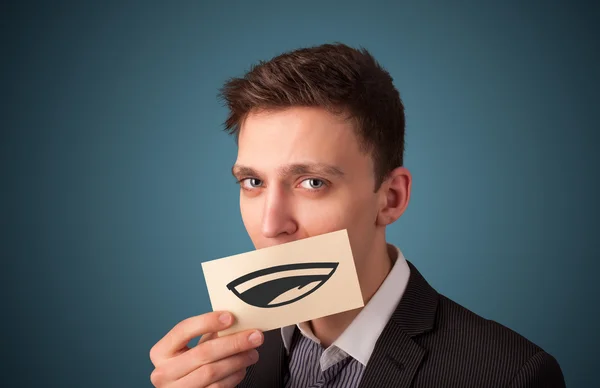 Empresário feliz segurando cartão branco engraçado em sua boca — Fotografia de Stock