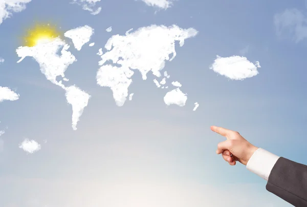 Hand pekar på världen moln och sol på blå himmel — Stockfoto