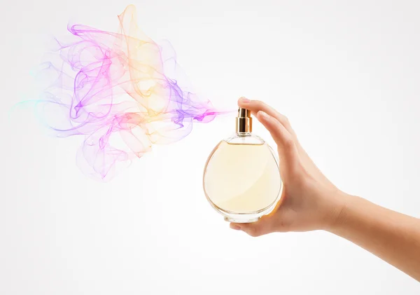 Woman hands spraying perfume — Stock Photo, Image