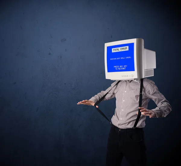 Person with a monitor head and fatal error blue screen on the di — Stock Photo, Image