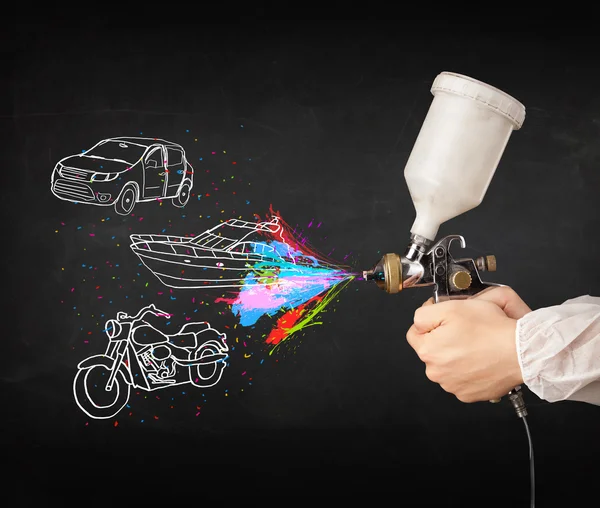 Man with airbrush spray paint with car, boat and motorcycle draw — Stock Photo, Image