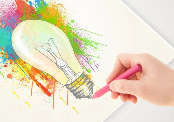 Hand drawing on paper a colorful splatter lightbulb — Stock Photo, Image