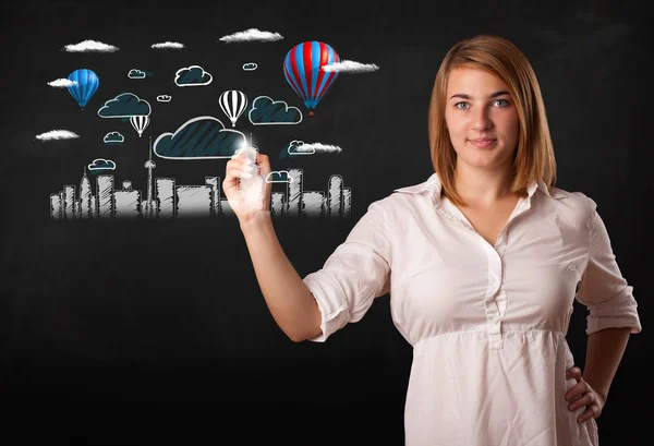 Pretty woman sketching cityscape with colorful balloons — Stock Photo, Image