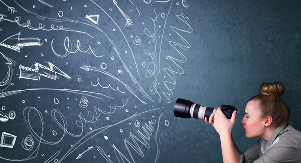 Photographer shooting images while energetic hand drawn lines an — Stock Photo, Image