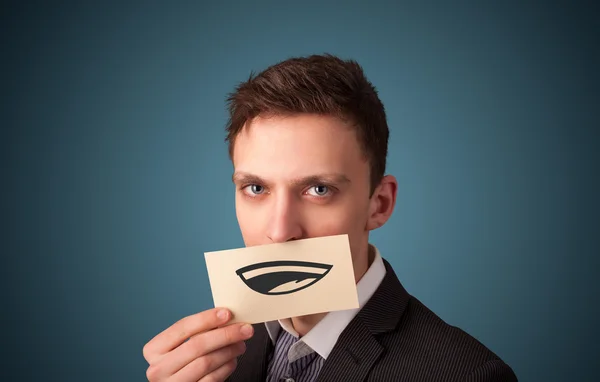 Щасливий бізнесмен тримає смішну білу картку в роті — стокове фото