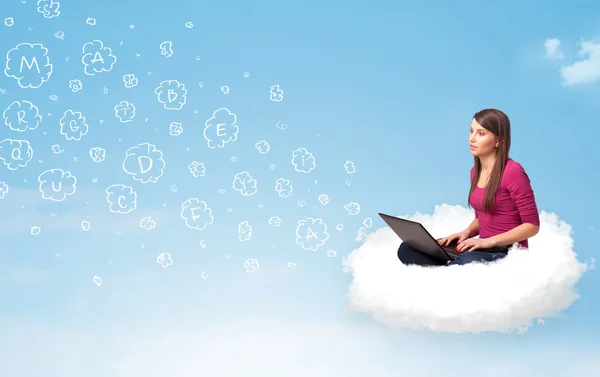 Young woman sitting in cloud with laptop — Stock Photo, Image