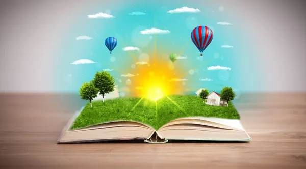 Open book with green nature world coming out of its pages — Stock Photo, Image