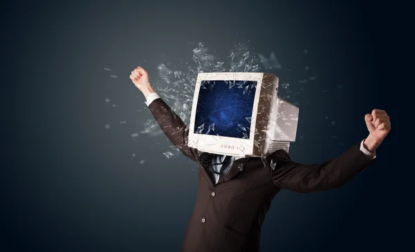 Computer monitor screen exploding on a young persons head — Stock Photo, Image